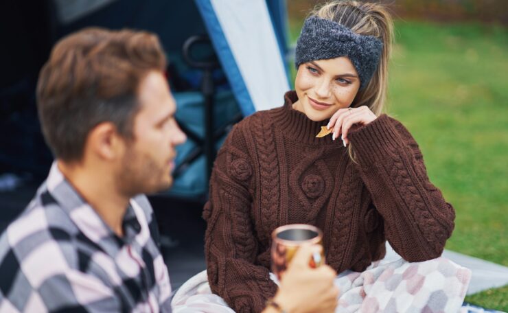 Young nice couple having fun on camping